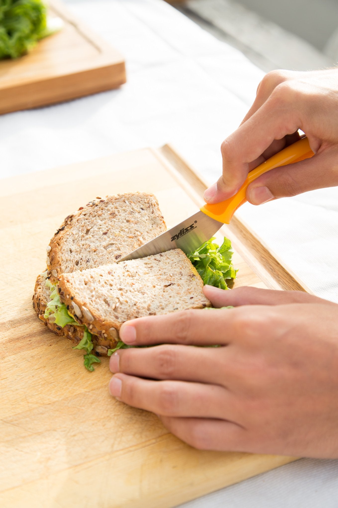 Zyliss Sandwich Knife & Condiment Spreader - Sandwich Spreader Knife for Butter, Cream Cheese, & Jellies - Butter for Bagels & Toast - Orange